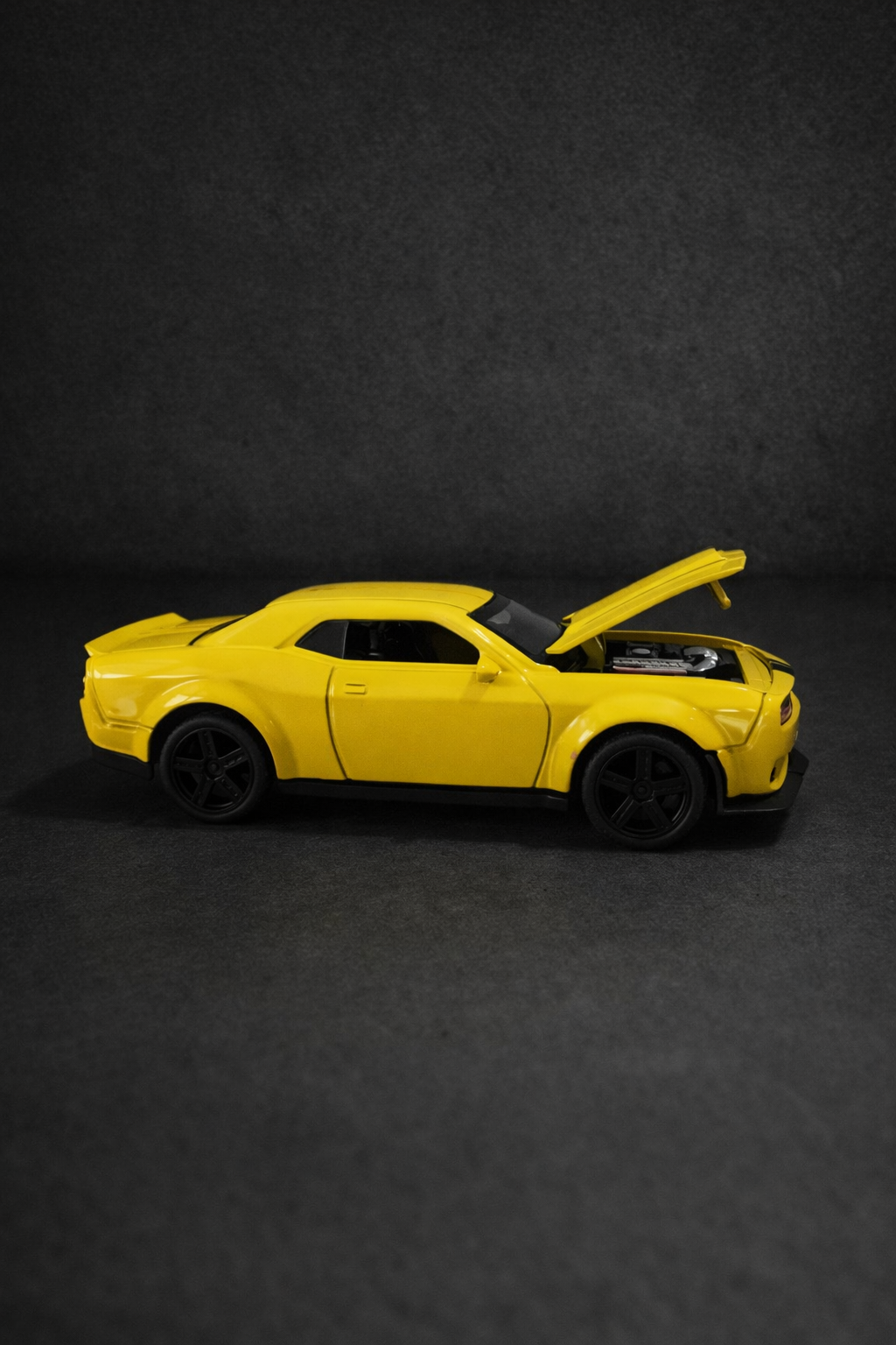 Dodge Challenger- Metal diecast 1:36 scale yellow with black.